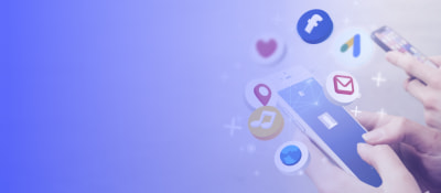 Social media icons around a mobile device held by two hands